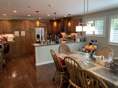 Interior view of a common area with kitchen and dining table