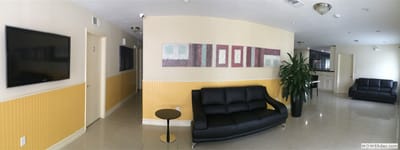 Interior lounge area with seating and artwork