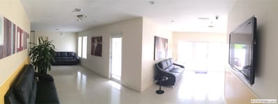 Welcoming lobby area with seating and art.