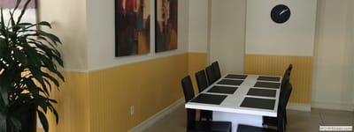 Dining area with table and artwork