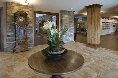 Interior common area with a decorative plant and clock