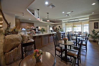 Cozy dining area with wooden tables and plants