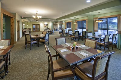 Bright and spacious dining room with tables and chairs