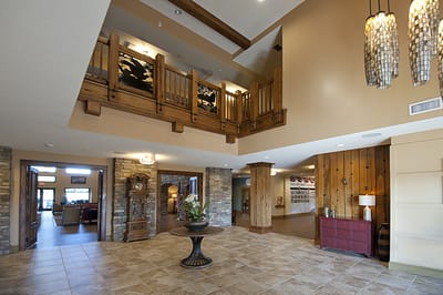 Lobby of a senior living facility with wooden decor