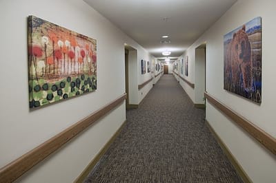 A hallway adorned with colorful artwork