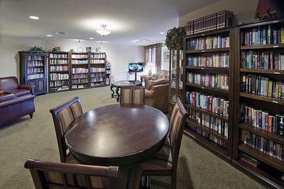 Common area with bookshelves and seating