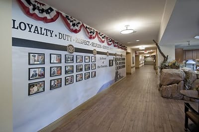 Interior hallway with a wall of photographs and decorations