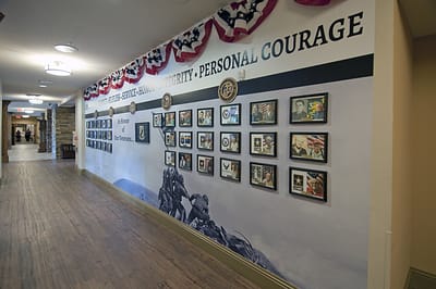 Hallway with decorated walls and framed pictures