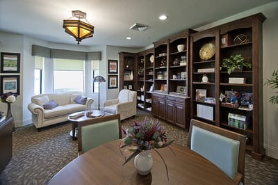 Cozy common area with seating and bookshelves