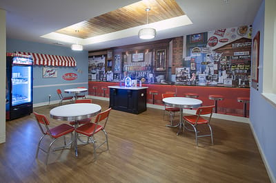 Vintage-themed dining area with red chairs and tables
