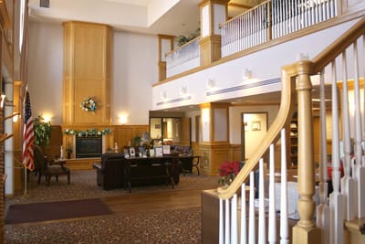 Interior view of a facility lobby with seating and decor