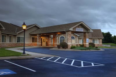 Exterior view of the facility entrance with landscaping