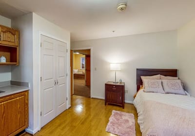 Private resident room with bed and furniture