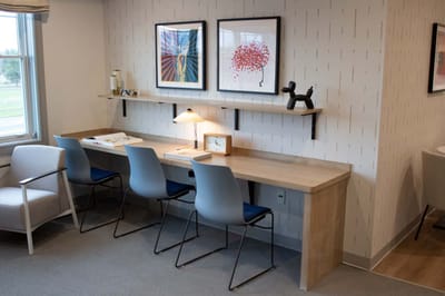 A cozy common area with seating and artwork