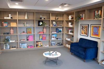 Interior common area with bookshelves and seating