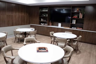 Interior view of a common area with tables and chairs