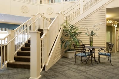 Bright open interior with stairs and seating area
