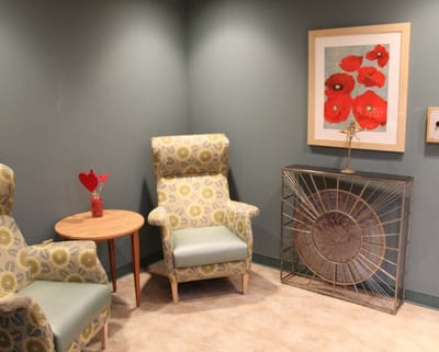 Comfortable seating area with art on the wall