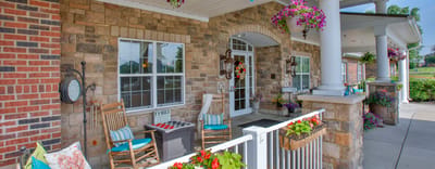 Front porch of a senior living facility with flowers
