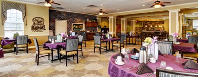 Dining room setup with tables and flowers