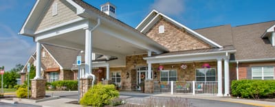 Building exterior with entrance and landscaping