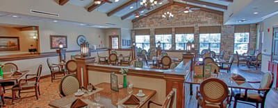 Dining area with elegant furnishings and natural light