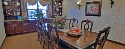 Interior dining room with a large table and decor