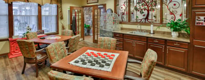 Common area with seating and games for residents
