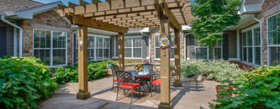 Outdoor shaded seating area with tables