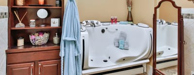 Accessible bathroom with therapeutic tub and amenities