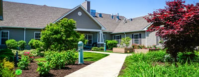 Well-maintained outdoor garden pathway with flowers