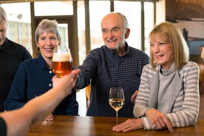 Residents enjoying drinks together in a social setting