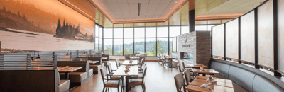 Bright dining area with large windows and modern decor