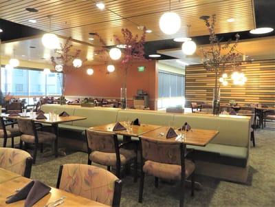 Bright dining room with elegant seating and lighting