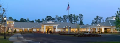 Exterior view of Wesley Pines facility at sunset