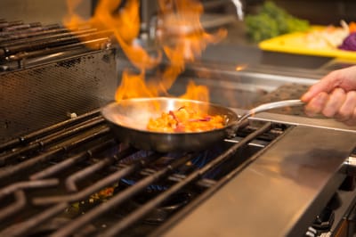 Cooking flames in a kitchen during meal preparation