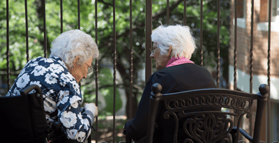 Two residents enjoying time together outdoors