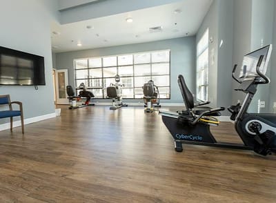 Interior view of an exercise room with fitness equipment