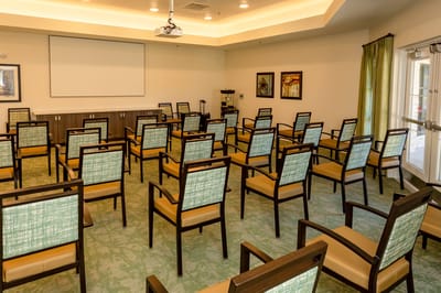Interior room set up for an event with chairs