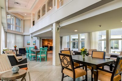 Bright common area with tables and seating