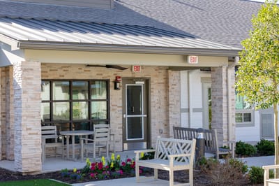 Exterior view of the facility entrance with seating area