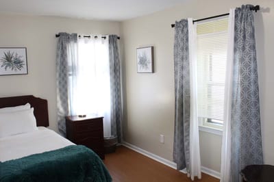 Cozy resident room with a bed and natural light