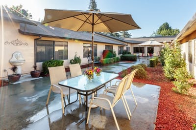 Outdoor seating area with tables and umbrellas