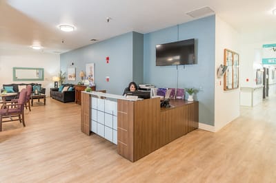 Reception area with staff at the front desk