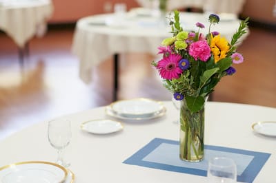 A floral centerpiece on a dining table