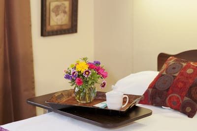 Colorful flower arrangement on a bedside tray