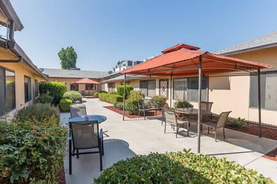 Outdoor courtyard space with shade structures and seating