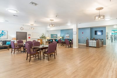 Common area with tables and seating for residents