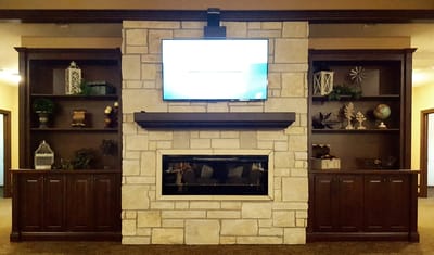 Interior common area with fireplace and TV