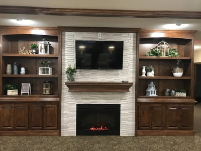 Welcoming common area with a fireplace and decor.